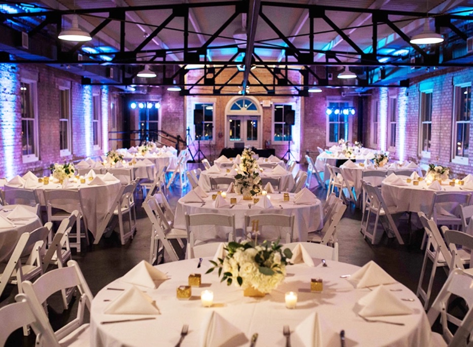 The Filter Building set for a banquet, with exposed brick walls and iron trusses