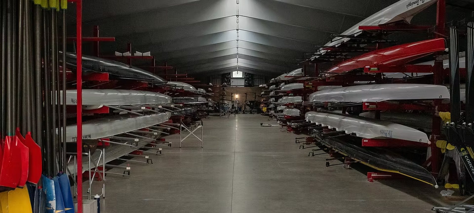 Racing shells racked in the boat bays of the White Rock Boathouse